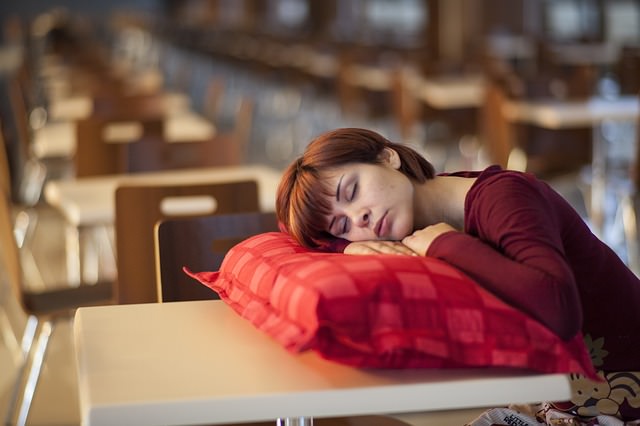 woman sleeping on cushion